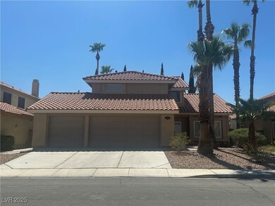 View of front of home with a garage, stucco siding