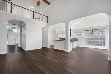 living room featuring crown molding, dark wood-typ