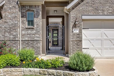 View of exterior entry featuring stone siding and