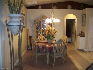 Dining room, kitchen on right side and guest hallway