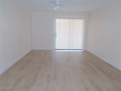 Spare room with a ceiling fan and light wood-type