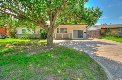 View of front of home with brick siding and driveway