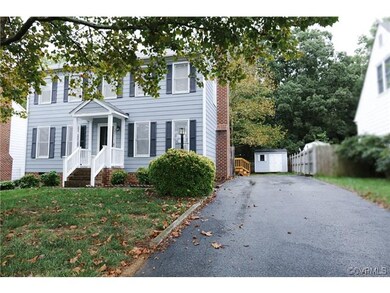 Exterior Front w/ Paved Driveway