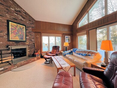 Living room w/ wood-burning Fireplace
