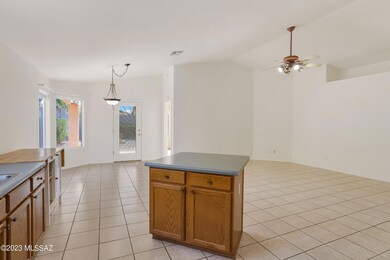 Kitchen looking into great room & dining