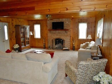 Masonary log and gas burning fireplace in living r