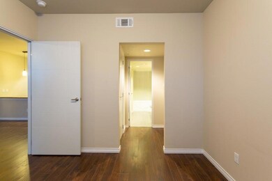 Hallway featuring dark hardwood / wood-style floor