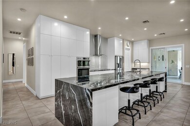 Kitchen featuring modern cabinets, stainless steel