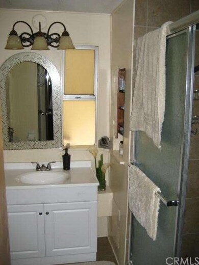 Second bath features new vanity as well and neutra