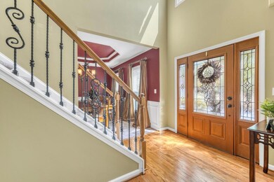 Beautiful door leading into the entry. Left is the
