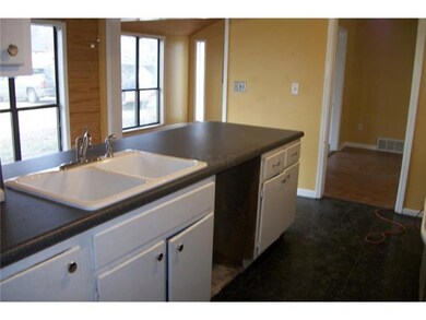 The kitchen opens to the sunny breakfast room!