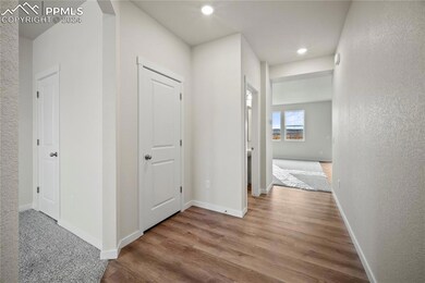 Hall featuring dark hardwood / wood-style flooring