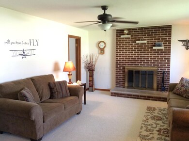 Living room with wood burning fireplace