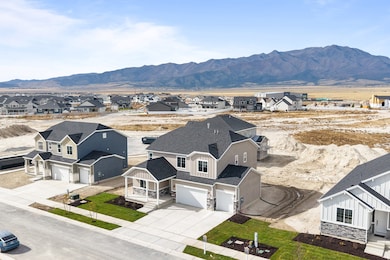 Aerial view of residential area featuring a mountainous background