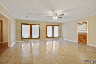 This is a very spacious living room. It can accommodate any size furniture and it is perfect for entertaining.