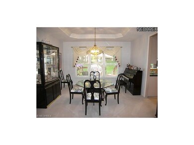 The formal dining room opens to the kitchen