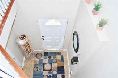 The 2 story entry welcomes you and allows access t