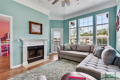 Cozy Living Room featuring fireplace and Balcony