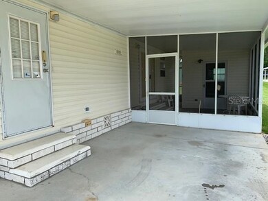 Carport with main entry & screen porch