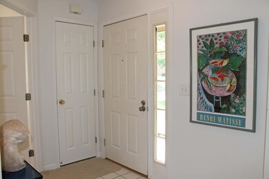 Foyer with ceramic tile flooring