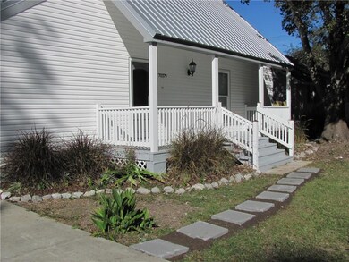 Large paver walkway lead past the garden to the ne