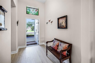 Spacious Foyer features a transom window and smart lock entry