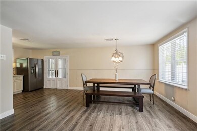 Grand Dining with fine fixtue off of Kitchen.  Furniture included in the sale thru out the home.