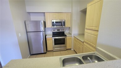 Kitchen featuring stainless steel appliances, ligh