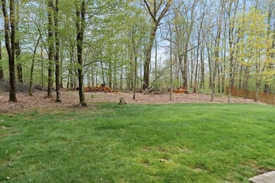 Stately trees offer privacy and a beautiful setting.