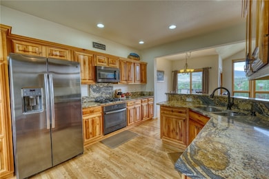 Kitchen with stainless steel appliances, granite c