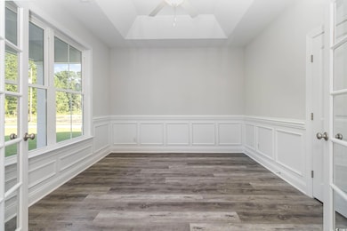 Spare room with dark hardwood / wood-style floorin