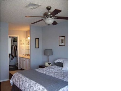 Master bedroom has private vanity alcove.