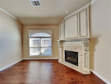 Unfurnished living room featuring a stone fireplac