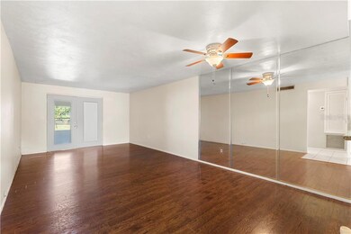 Living/Dining room area looking towards rear enclo