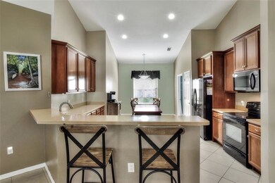 Kitchen with a Breatfast Bar and a separate eat in