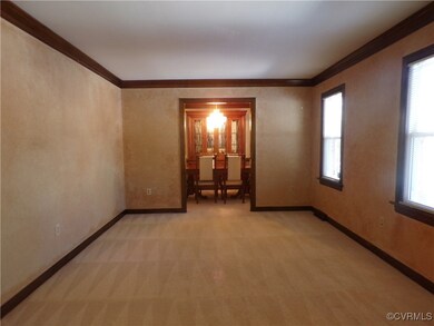 Living room featuring crown molding