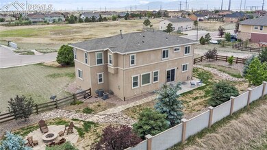 professionally landscaped yard with fire pit