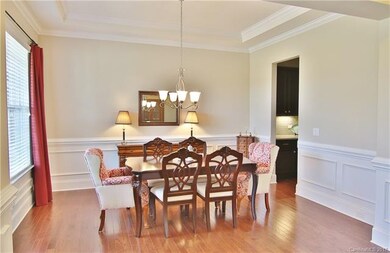 Formal Dining Room with trey ceilings, Walk through double butlers pantry with built in wine cooler!