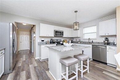 completely remodeled kitchen with granite countertops and new flooring. All new appliances in this room stay.