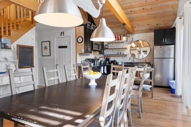 Open floorplan highlights the wood floors, cathedral ceilings and bonus loft space.