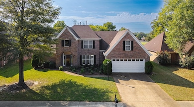 View of front of house featuring a garage and a fr