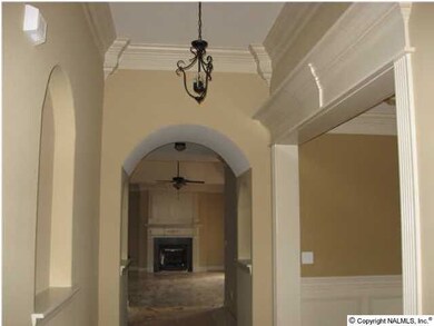 Arched entry from foyer to great room.