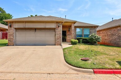 Single story home with a front lawn and a garage
