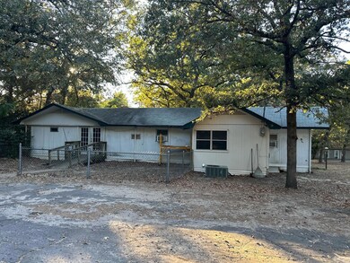 Rear view of house featuring cooling unit