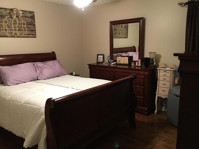 Upstairs MBR with hall full bath and extra linen and storage closets in the hallway.