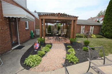 New custom pergola and concrete pad with lush new 