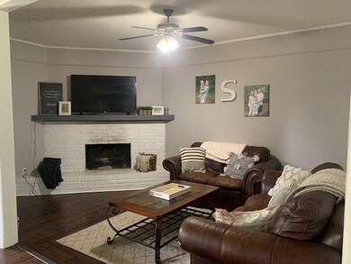 Living room with wood burning fireplace