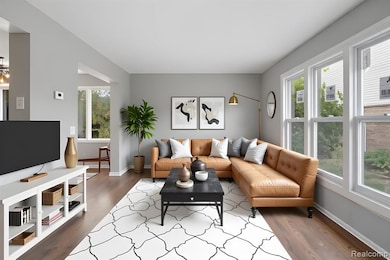 Living room with wood finished floors and baseboards