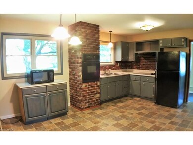 Large eat in kitchen with lots of texture. Applian