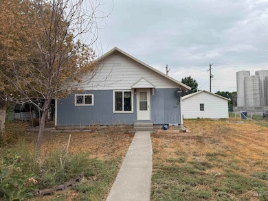 Bungalow-style house with a front yard